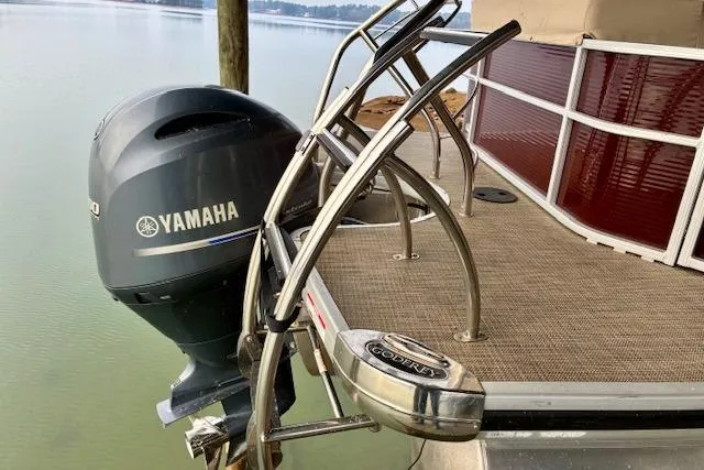 Slide: The Image of 2019 Godfrey Sweetwater boat with Yamaha motor on a calm lake. - 9