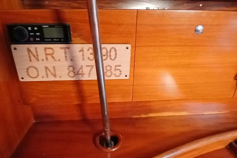 Slide: The Image of Interior of 1994 Beneteau Oceanis 44 CC with registration plaque and control panel. - 23