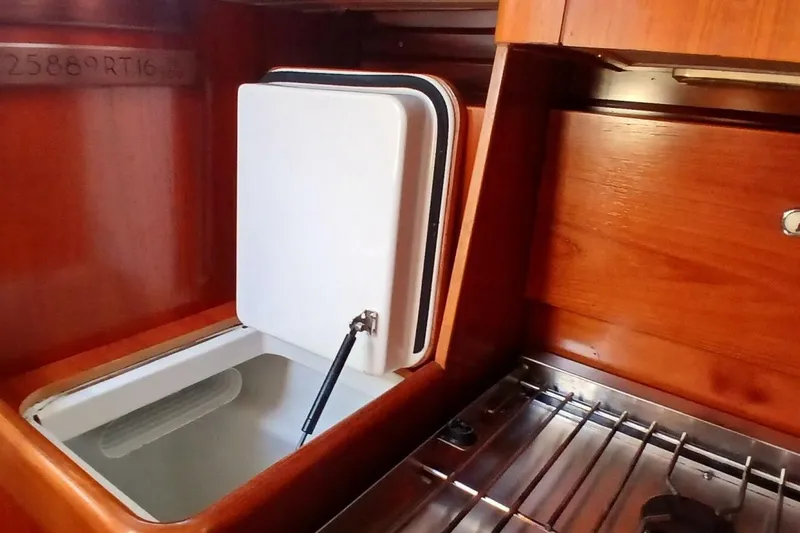 Slide: The Image of Interior of 1994 Beneteau Oceanis 44 CC yacht with open storage compartment. - 27