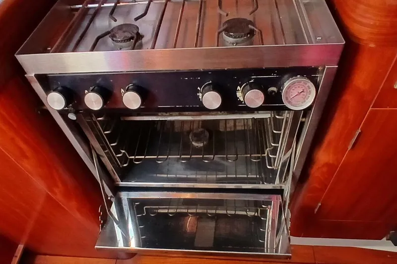 Slide: The Image of Stainless steel stove and oven in 1994 Beneteau Oceanis 44 CC yacht kitchen. - 35