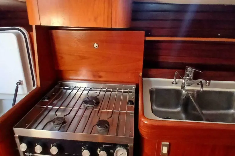 Slide: The Image of Galley kitchen in 1994 Beneteau Oceanis 44 CC yacht with stove and sink. - 36