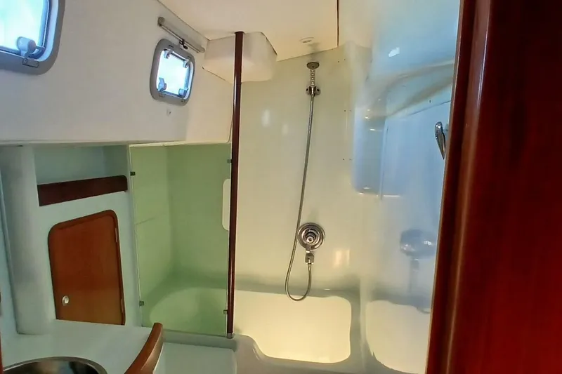 Slide: The Image of Interior of 1994 Beneteau Oceanis 44 CC yacht bathroom with shower and sink. - 47