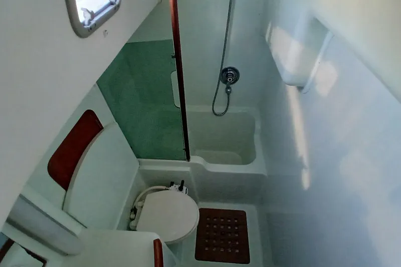 Slide: The Image of Bathroom interior of 1994 Beneteau Oceanis 44 CC yacht, featuring shower and toilet. - 50