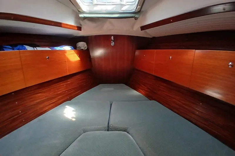 Slide: The Image of Cozy cabin interior of 1994 Beneteau Oceanis 44 CC sailboat with wooden storage cabinets. - 61