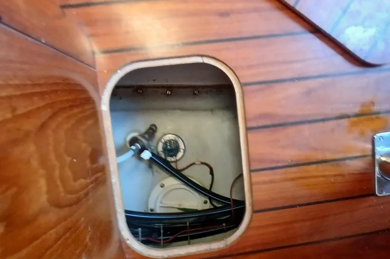 Slide: The Image of Beneteau Oceanis 44 CC 1994 yacht interior compartment with visible wiring and plumbing. - 75