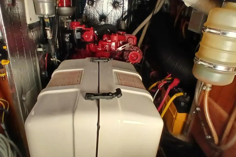 Slide: The Image of Engine room of 1994 Beneteau Oceanis 44 CC sailboat, featuring mechanical components. - 78