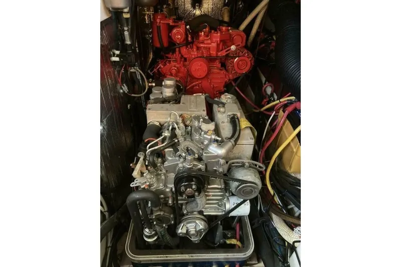 Slide: The Image of Engine compartment of a 1994 Beneteau Oceanis 44 CC sailboat, showcasing mechanical components. - 82