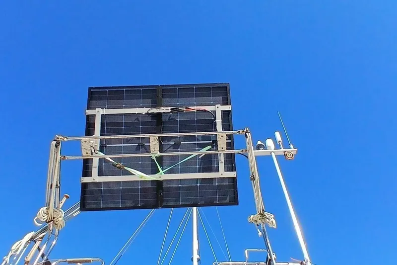 Slide: The Image of Solar panels on a 1994 Beneteau Oceanis 44 CC sailboat against a clear blue sky. - 90