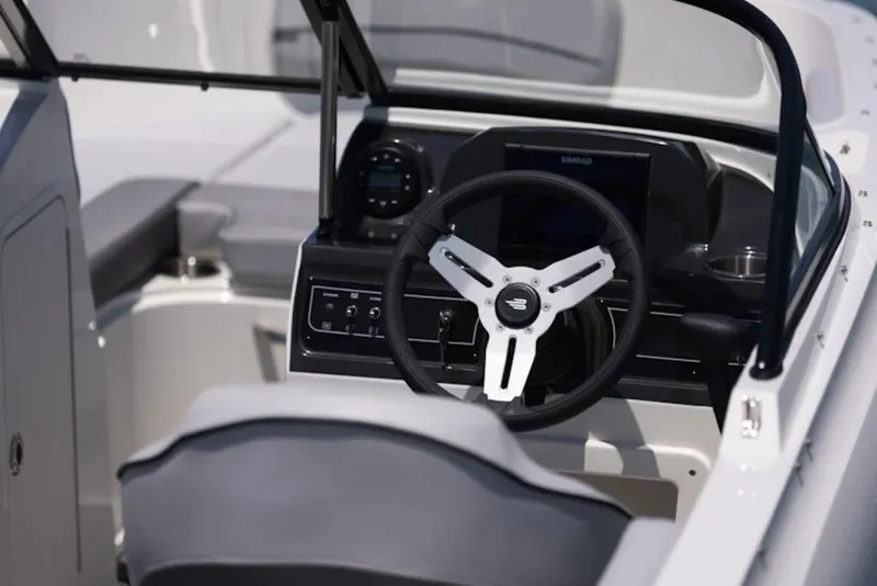 Slide: The Image of 2026 Bayliner VR4 Bowrider OB steering console with modern controls and sleek design. - 5