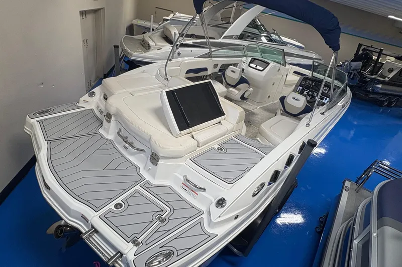 Slide: The Image of 2012 Chaparral 246 SSi boat with sleek design and spacious seating in showroom. - 3