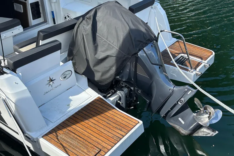 Slide: The Image of 2022 Jeanneau NC 795 Series 2 with Yamaha 250 V6 outboard motor on water. - 12