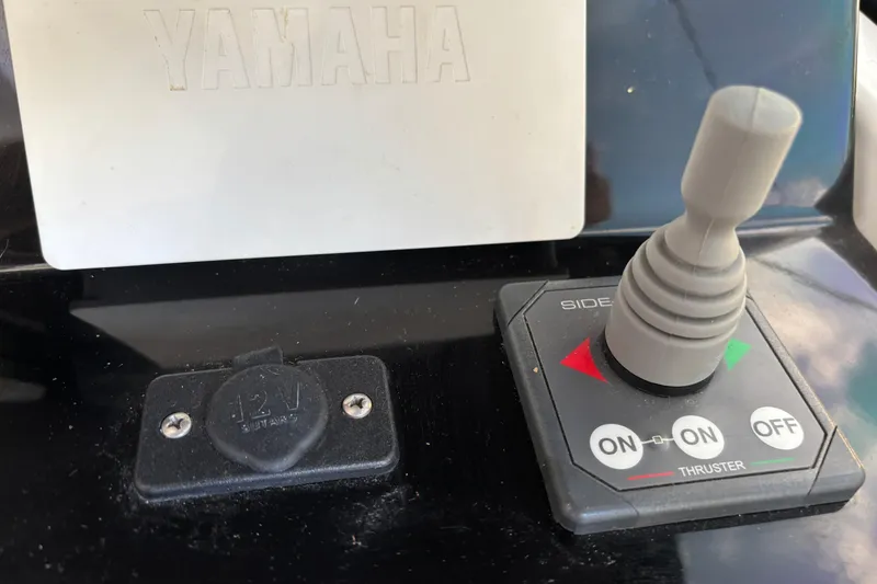 Slide: The Image of Control panel of 2022 Jeanneau NC 795 Series 2 with Garmin and Yamaha displays. - 16