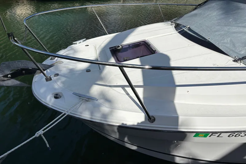Slide: The Image of 2022 Jeanneau NC 795 Series 2 boat bow with railing and anchor in water. - 24