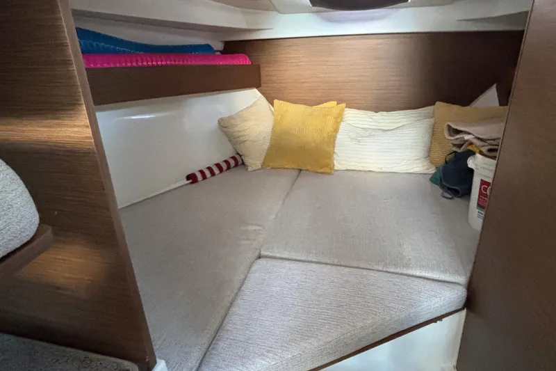 Slide: The Image of Cozy cabin interior of 2022 Jeanneau NC 795 Series 2 with cushions and soft bedding. - 6