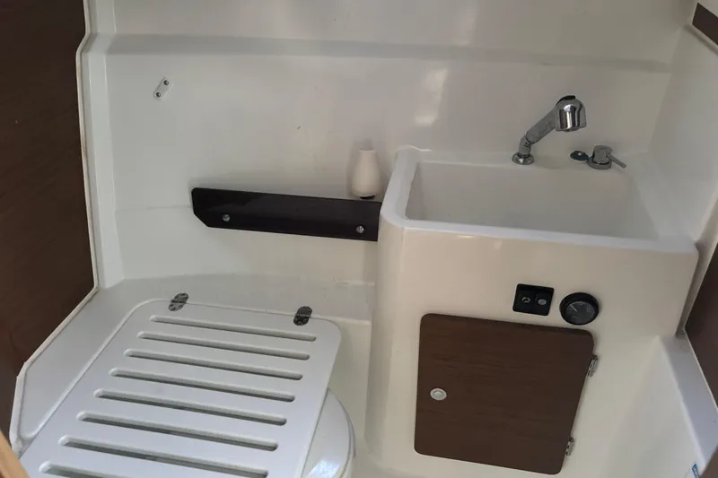 Slide: The Image of Cozy cabin interior of 2022 Jeanneau NC 795 Series 2 with cushions and bedding. - 7