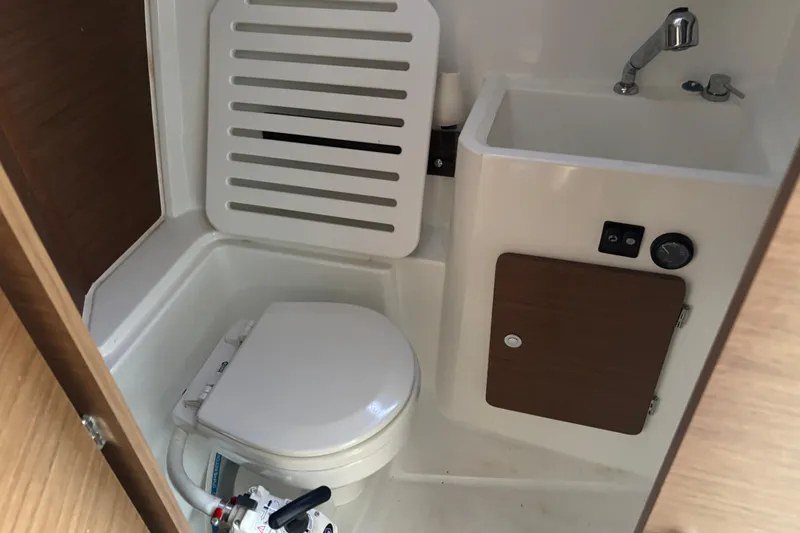 Slide: The Image of 2022 Jeanneau NC 795 Series 2 boat interior with sink and storage. - 8