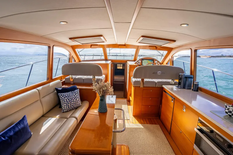 Slide: The Image of Luxurious interior of 2018 Palm Beach Motor Yachts PB50 with elegant seating and ocean view. - 15