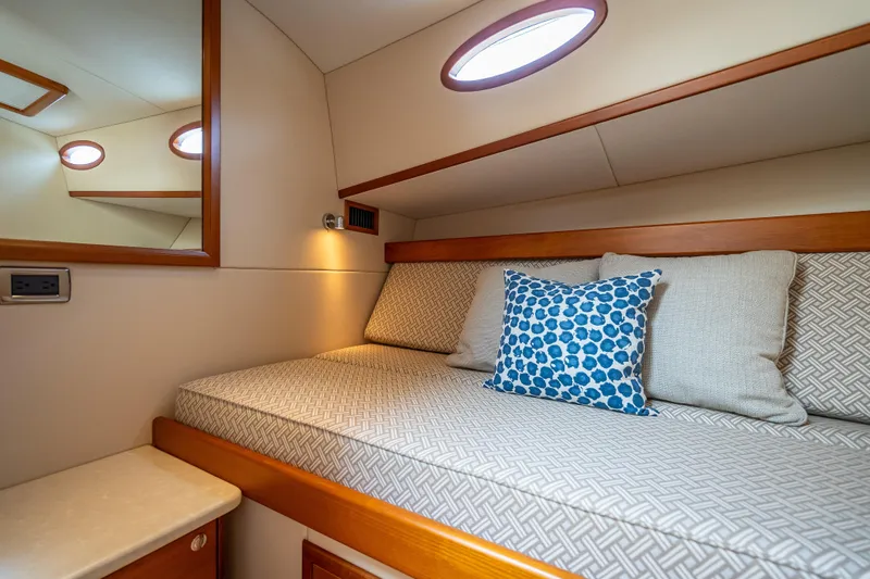 Slide: The Image of Luxurious cabin interior of 2018 Palm Beach Motor Yachts PB50 with cozy bedding and cushions. - 20