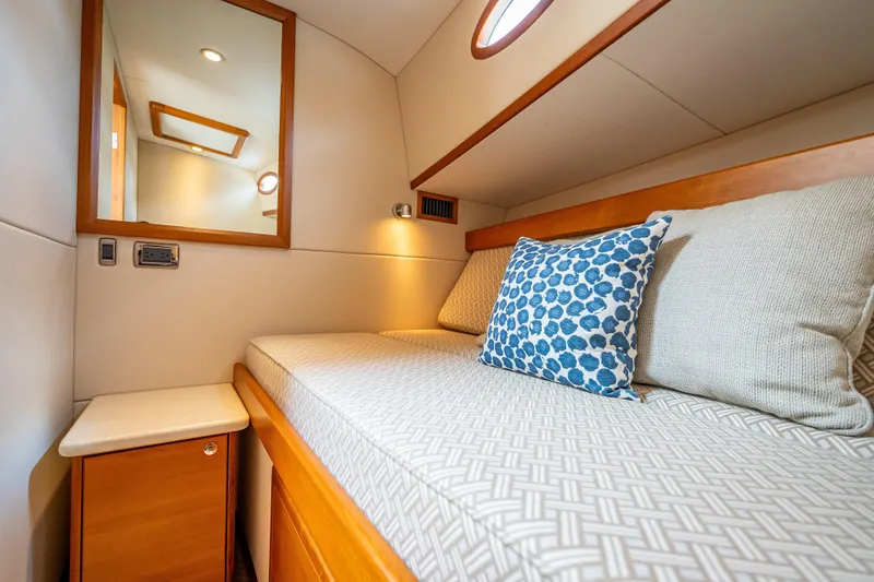 Slide: The Image of Luxurious cabin interior of 2018 Palm Beach Motor Yachts PB50 with cozy bedding and elegant decor. - 22
