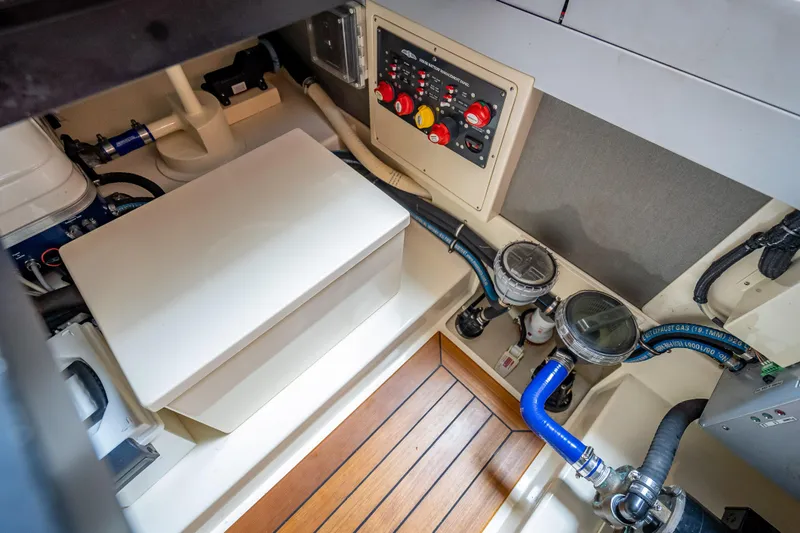 Slide: The Image of Engine room of 2018 Palm Beach Motor Yachts PB50, featuring control panel and piping. - 33