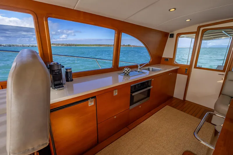 Slide: The Image of Luxurious interior of 2018 Palm Beach Motor Yachts PB50 with ocean view. - 13