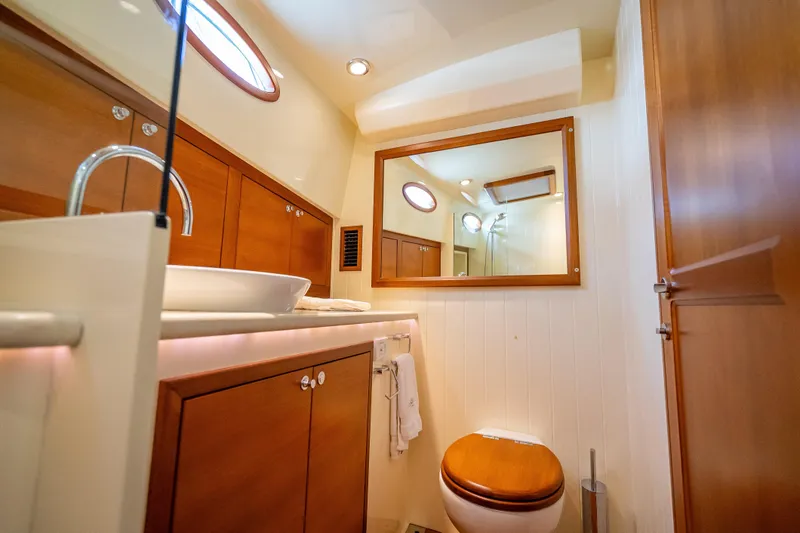Slide: The Image of Luxurious bathroom interior of 2018 Palm Beach Motor Yachts PB50, featuring wood accents and modern fixtures. - 23