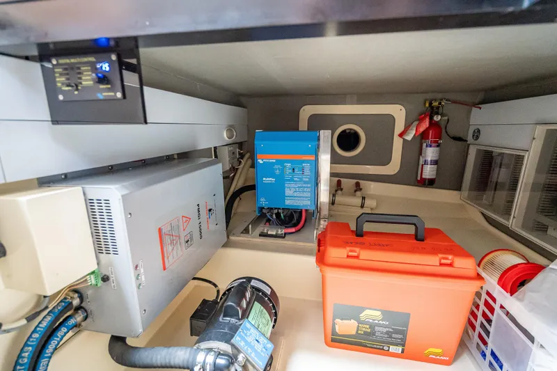 Slide: The Image of Engine room of 2018 Palm Beach Motor Yachts PB50 with equipment and safety gear. - 32