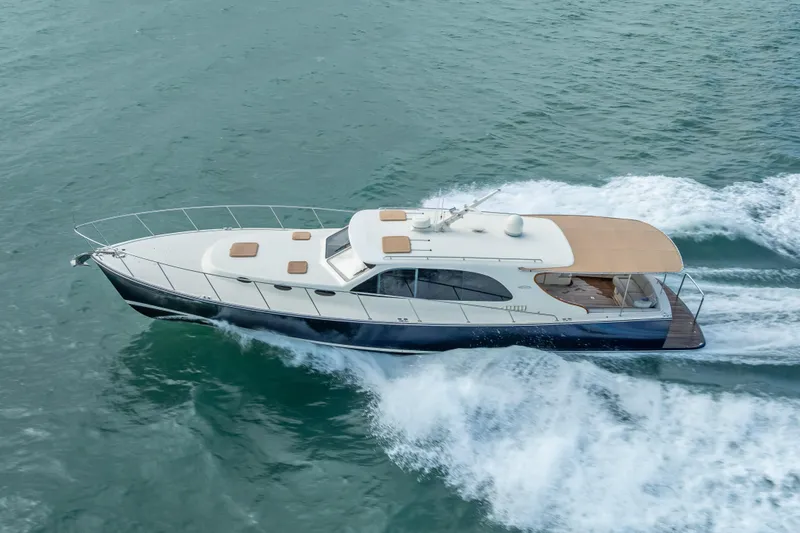 Slide: The Image of 2018 Palm Beach Motor Yachts PB50 cruising on open water. - 41