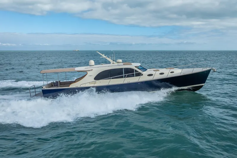 Slide: The Image of 2018 Palm Beach Motor Yachts PB50 cruising on open sea under cloudy sky. - 43