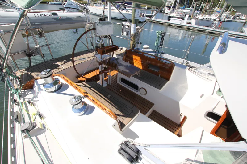 Slide: The Image of Cockpit of 1998 Able Apogee 50 sailboat with wooden accents and steering wheel. - 10