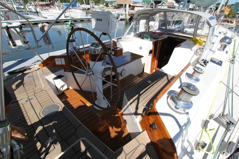 Slide: The Image of Cockpit of 1998 Able Apogee 50 sailboat with wooden deck and steering wheel. - 11