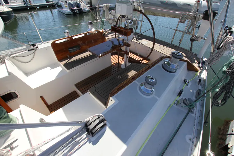 Slide: The Image of Cockpit of 1998 Able Apogee 50 sailboat with wooden seating and steering wheel. - 13