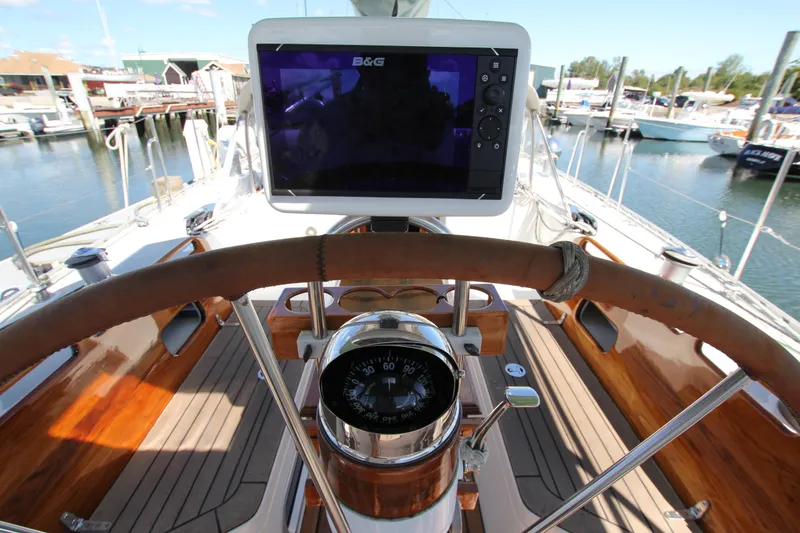 Slide: The Image of Steering wheel and navigation system on 1998 Able Apogee 50 yacht at marina. - 14