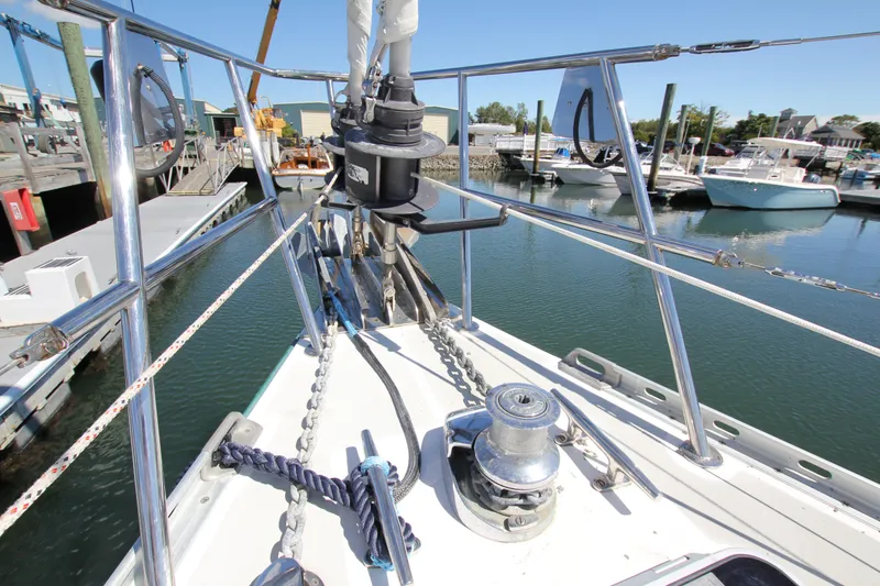 Slide: The Image of Bow of Able Apogee 50 sailboat, 1998 model, docked in marina with clear blue sky. - 2