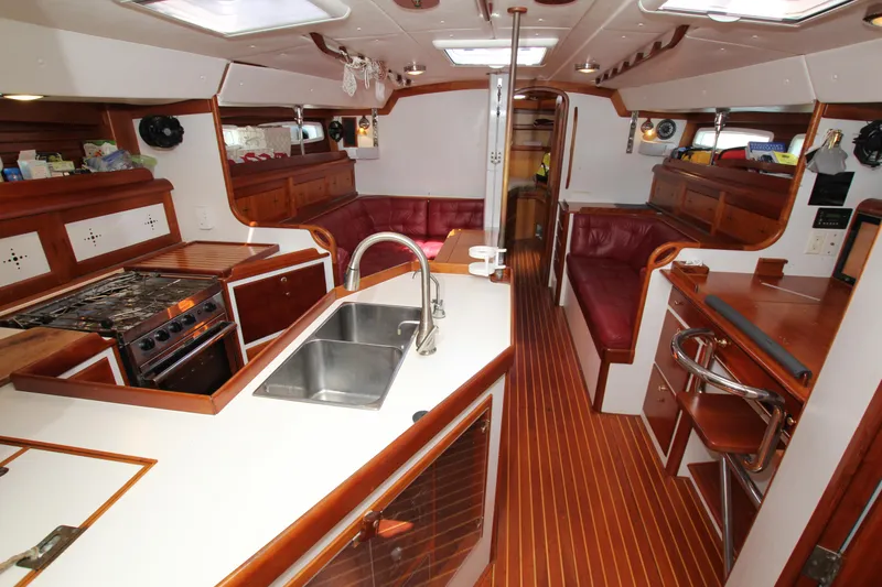 Slide: The Image of Interior of 1998 Able Apogee 50 yacht with wood finish and modern kitchen amenities. - 24
