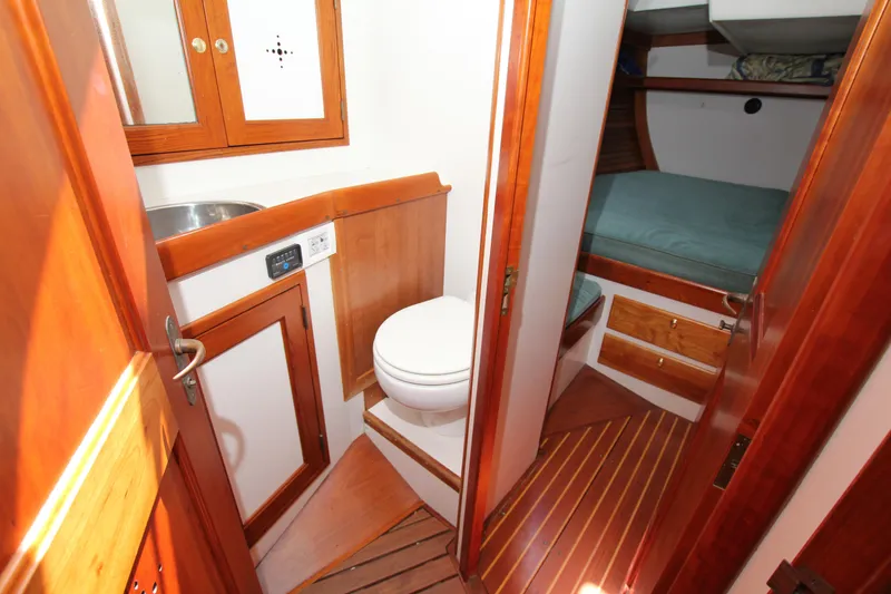 Slide: The Image of Wooden interior of 1998 Able Apogee 50 yacht with bathroom and cabin. - 30