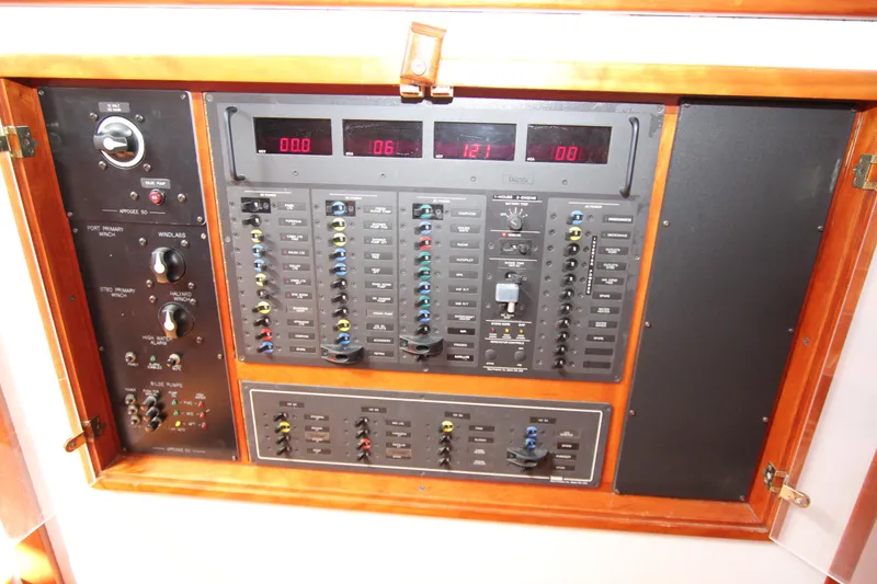 Slide: The Image of Electrical control panel of a 1998 Able Apogee 50 yacht with switches and displays. - 33