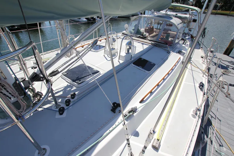 Slide: The Image of Sailboat deck of 1998 Able Apogee 50, featuring rigging and cockpit area. - 7