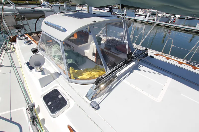 Slide: The Image of Sailboat Able Apogee 50, 1998 model, docked with visible cockpit and equipment. - 9