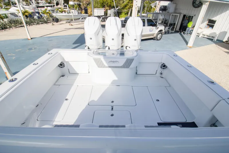 Slide: The Image of 2026 Invincible 39 Open Fisherman boat with triple outboard engines, spacious deck. - 14