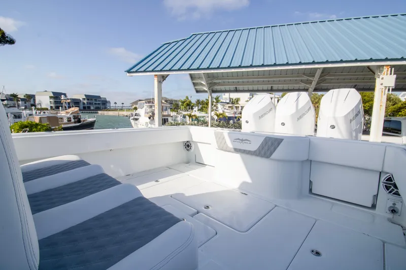 Slide: The Image of 2026 Invincible 39 Open Fisherman boat with Mercury engines docked at marina. - 15