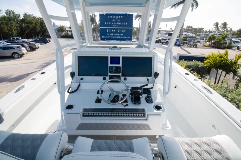 Slide: The Image of Cockpit view of 2026 Invincible 39 Open Fisherman boat with modern controls and displays. - 2