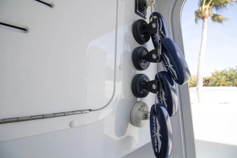 Slide: The Image of Key fobs hanging inside a 2026 Invincible 39 Open Fisherman boat. - 22