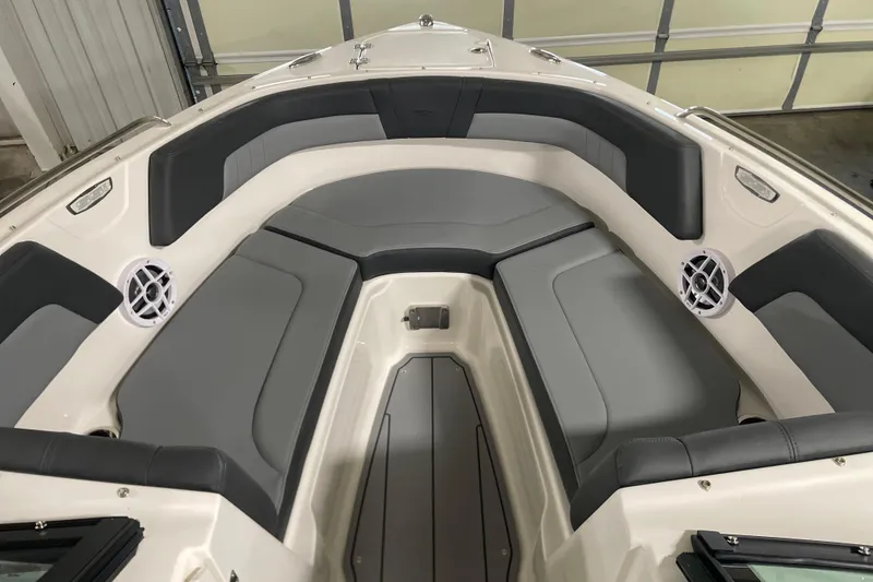 Slide: The Image of 2026 Chaparral GTS 3 boat interior with gray seating and speakers. - 2