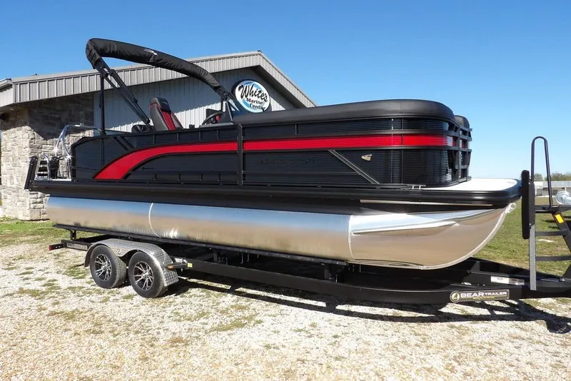 The Image of 2026 Bennington S Swingback 22 SSB pontoon boat on trailer, outdoor display. - 1