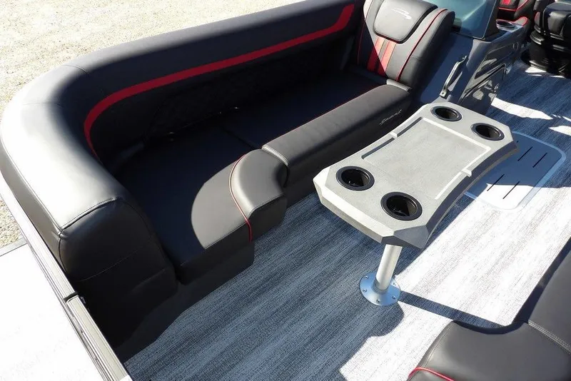 Slide: The Image of 2026 Bennington S Swingback 22 SSB interior with black seating and cupholder table. - 10