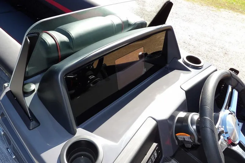 Slide: The Image of 2026 Bennington S Swingback 22 SSB dashboard with steering wheel and controls. - 12