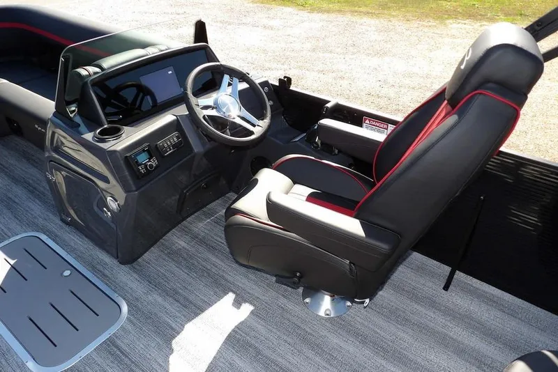 Slide: The Image of 2026 Bennington S Swingback 22 SSB boat interior with steering wheel and captain's chair. - 17