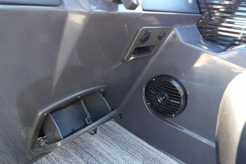 Slide: The Image of Interior detail of 2026 Bennington S Swingback 22 SSB with speaker and storage compartment. - 21