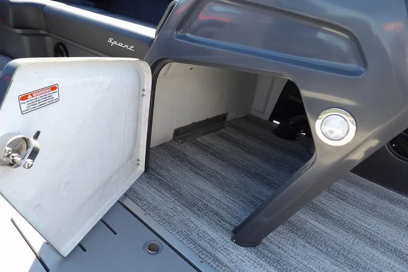 Slide: The Image of Open storage compartment on 2026 Bennington S Swingback 22 SSB boat. - 22